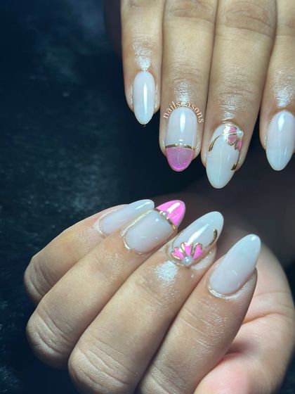 Soft elegance with a hint of shine. This milky white set features delicate pink floral art and subtle chrome details.