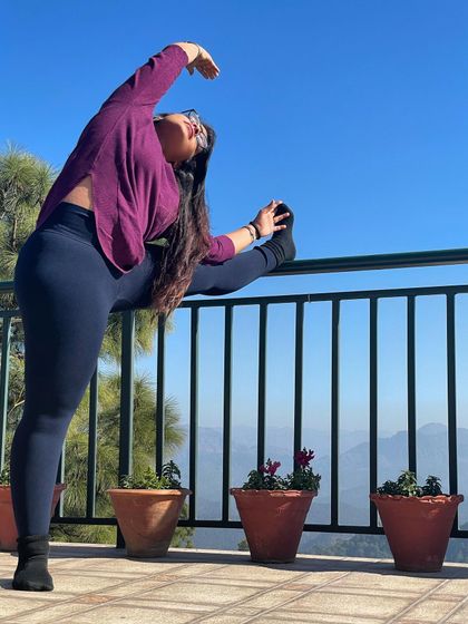 A little stretch is a must, especially while traveling. This standing leg stretch on the railing helps to relieve stiffness in the hamstrings and hips after a long journey.