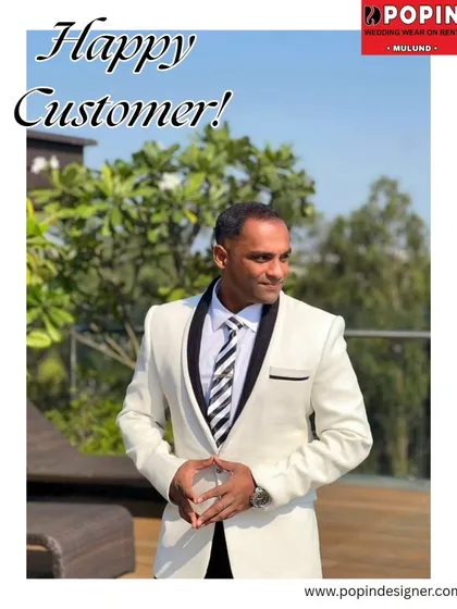 Seeing my clients happy is the best part of my job. This customer looks incredibly sharp and confident in our white tuxedo, proving you don't need to own an outfit to own the look.