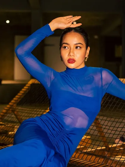 I love playing with color, and this shoot was the perfect opportunity. The vibrant blue of the dress is balanced with a glossy red lip and sharp, clean eyeliner for a striking, high-fashion editorial result.