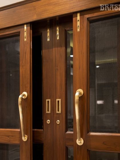 At the Jain residence, our Talisha Door Pulls in a Gold Satin finish offer a clean, modern symmetry. Paired with matching flush bolts and cup pulls, they create a cohesive and sophisticated entrance.