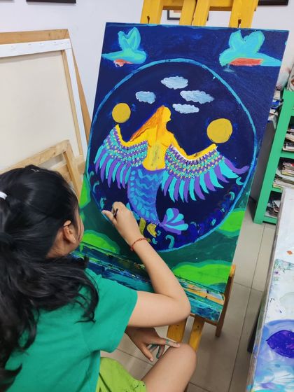 These images document the creation of a whimsical mermaid painting, showing the layering of colors and development of the composition.