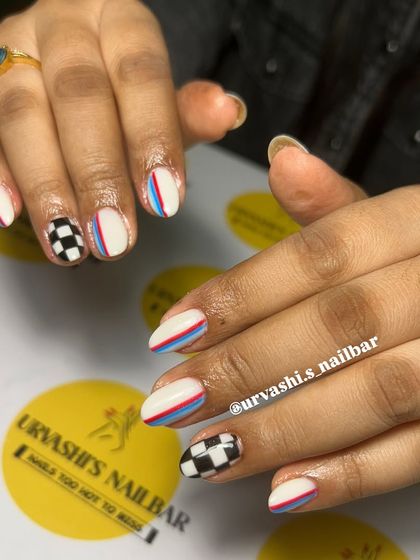 For the car enthusiast, this set was inspired by BMW. I hand-painted the logo, the iconic M-series stripes, and a checkered racing flag for a high-speed manicure.