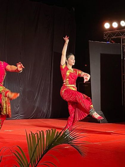 A dynamic shot of me performing alongside two of my senior students. Their technique and stage presence make me incredibly proud.