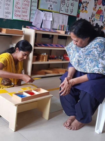 A teacher from Senthil Public School demonstrates her understanding of Montessori materials during a review session. We are proud to support educators in diverse regions of India.