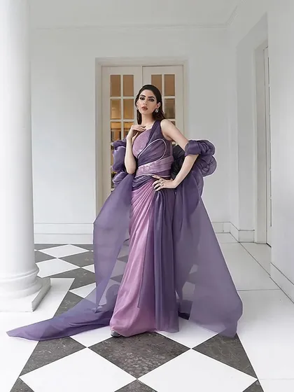 A full-length view of the stunning two-tone purple gown by Amit Aggarwal. The dramatic silhouette and expert draping make it a true couture statement piece.