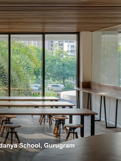 A learning space at Vedanya School, Gurugram, with large windows connecting the interior to the lush greenery outside. We design future-proof spaces that are sustainable, efficient, and adaptable to the evolving needs of communities.