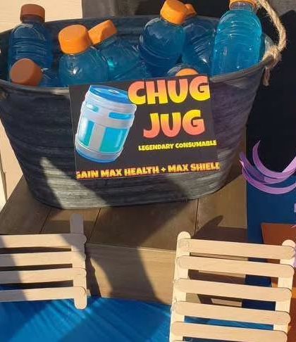 A 'Chug Jug' drink station from a 'Fortnite' themed birthday party. This creative detail, inspired by the popular game, is always a huge hit with kids and gamers.