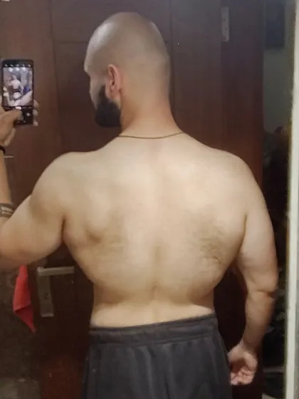 A different angle on my one year transformation, showing the changes in back definition and width. Don't chase perfection, chase CONSISTENCY.
