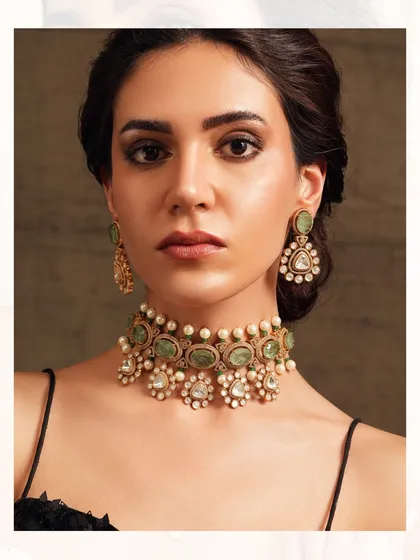 A delicate choker featuring pastel green stones and floral polki motifs, perfect for a sangeet or mehendi ceremony.