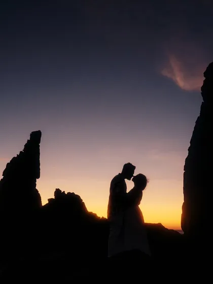 A stunning silhouette of a couple kissing against the vibrant colors of a Goan sunset. This classic romantic shot is a must-have for any beach pre-wedding photography session.