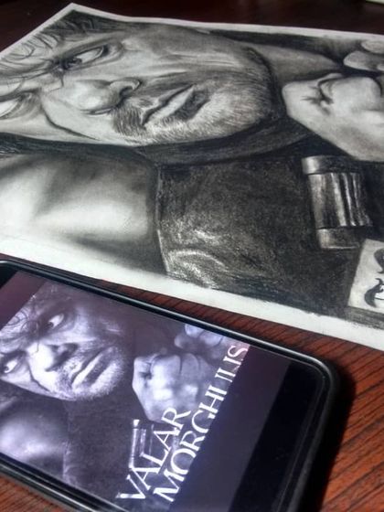 My finished charcoal drawing of Tyrion Lannister next to its inspiration. It shows how I translate a character from the screen to paper, focusing on the emotion in their expression.