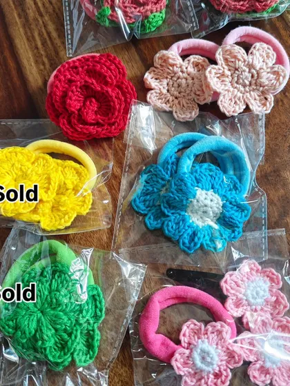 Some of my floral scrunchies and clips ready for a sale. The yellow and green ones were sold, but the others are still available. Each one is unique.