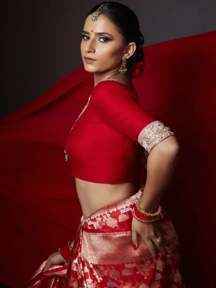 This look is my 'lal ishq', my pure passion for creating something powerful and timeless. I focused on a flawless base, dramatic smokey eyes, and a defined brow to complement the rich red Banarasi saree, creating a modern yet classic editorial statement.