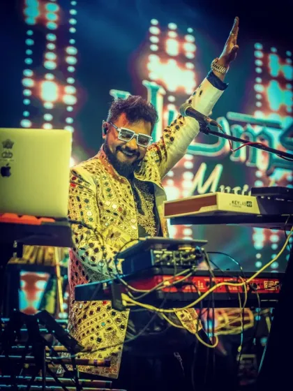 Our keyboardist raising a hand to the sky, feeling the energy of the room at the JW Marriott.