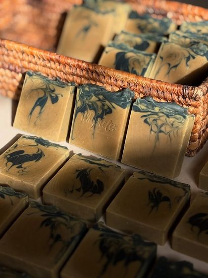 A close-up of our Hemp Help bars, ready to be wrapped. The earthy fragrance of rosemary, tea tree, and white tea makes it a calming treat for skin that needs a little extra love.