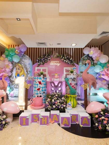 This was for Ishaara's first birthday, another take on the 'Onederland' theme. I used a pink fairy house, flamingo props, and giant mushrooms to give it a unique, magical twist.