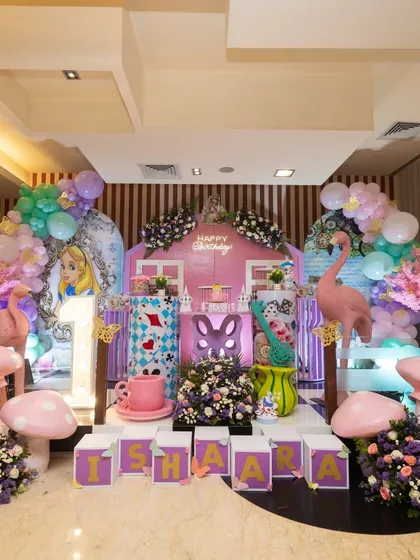 This was for Ishaara's first birthday, another take on the 'Onederland' theme. I used a pink fairy house, flamingo props, and giant mushrooms to give it a unique, magical twist.