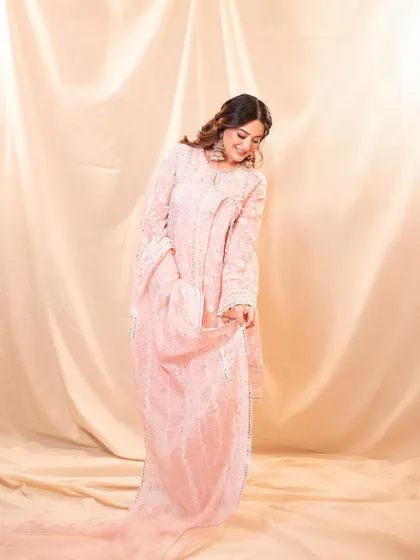 A full length view of Mahhi Vij in the Anmika Organza Pink Kurta set. The flowy silhouette is perfect for any festive occasion.