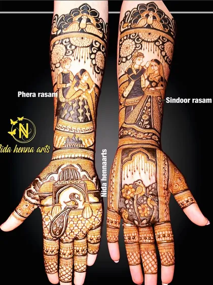 This heavy bridal design incorporates two key rituals: the Phera rasam on one arm and the Sindoor rasam on the other.