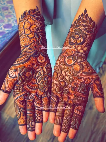 A stunning example of a fully developed henna stain, showcasing the intricate details of the bridal design.