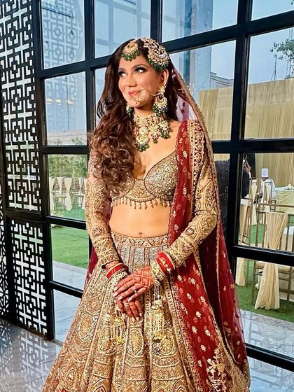 A three-quarter shot capturing her joyful expression and the beautiful details of her bridal look.