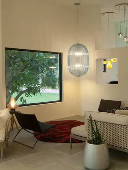 A lounge area within the Delhi experience center. The space is curated with designer lighting and comfortable seating, creating a sophisticated environment that encourages engagement and conversation.