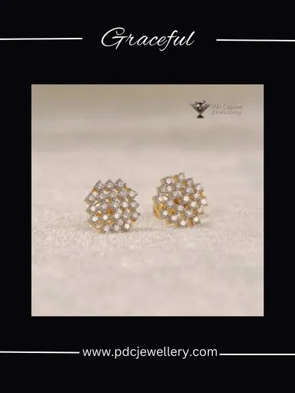 A graceful pair of diamond cluster stud earrings. The arrangement of diamonds creates a beautiful, sparkling effect that is both elegant and eye-catching.