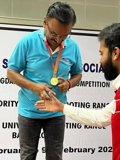 Krishna Prasad receiving his gold medal for the 10M Air Pistol Master Men event.