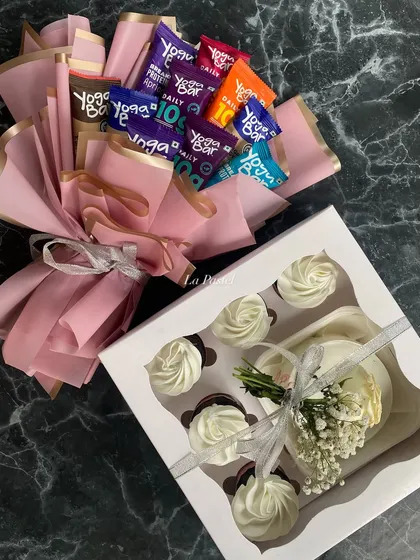 For the person who loves sweets but also stays healthy. This hamper pairs a box of my classic white-frosted cupcakes with a bouquet of Yoga Bars.