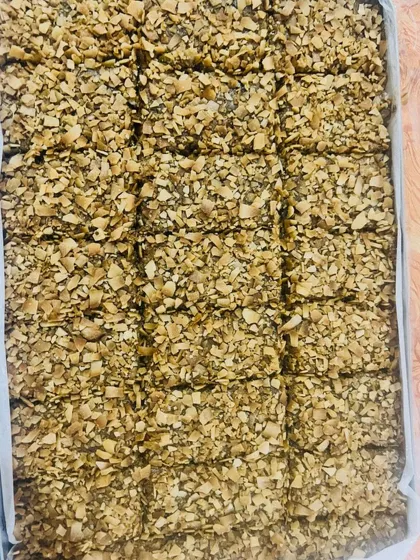 This tray is filled with my Almond & Walnut with Cinnamon bars, topped with toasted coconut flakes. The warm spice of cinnamon pairs beautifully with the crunchy nuts.
