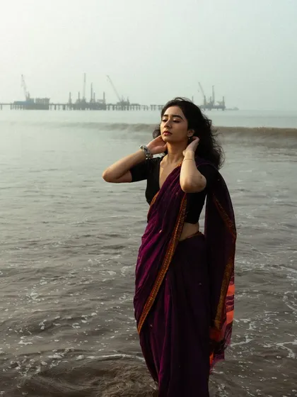 This shot captures a feeling of contemplation, looking out at the horizon with the vast sea stretching out.