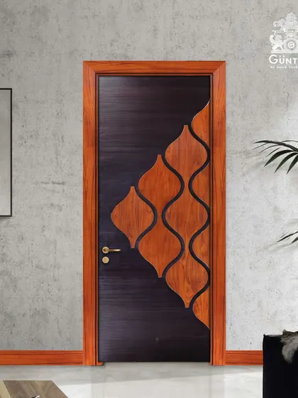 This door features a playful yet elegant design with flowing, organic shapes inlaid into a dark, textured veneer. It's a unique piece that adds artistic flair to the room.