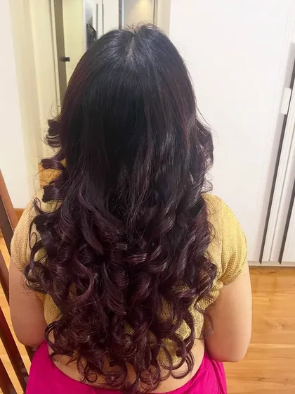 It's all about those perfect, bouncy curls. I specialize in creating soft, natural-looking hairstyles using your own hair that hold their shape without feeling stiff, perfect for an open-hair look.