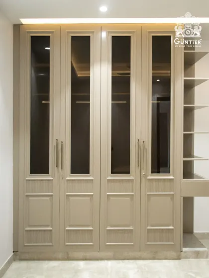 The full view of this elegant wardrobe, complete with an integrated open shelving unit for display items or daily essentials.