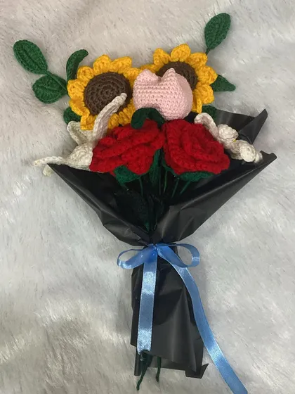 A top-down view of the mixed flower bouquet, showing the beautiful arrangement of different shapes and colors.