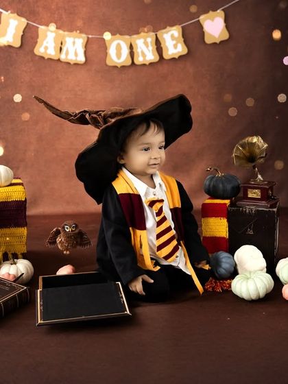 Trying on the Sorting Hat to see which house he belongs to. I encourage playful interaction with the props to capture the most natural and fun moments during the shoot.