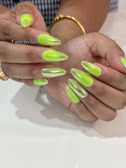 A vibrant and eye-catching set of neon green chrome nails. This look is perfect for summer or for anyone who loves a bold pop of color.