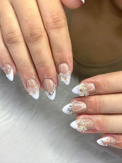 A stunning bridal look with a white French tip, accented with 3D bows and silver gems. You'll learn how to create elegant and durable wedding nails.