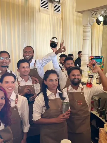 A candid moment with our diverse and energetic bartending team at a wedding event. This photo captures the fun and collaborative spirit of our crew, who work together to create a lively bar atmosphere.