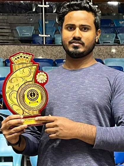 Holding a trophy from the All India Karate Championship. This represents the hard work and dedication of our entire academy.