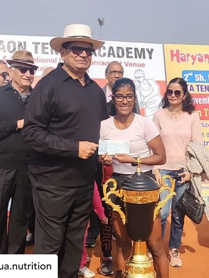 Here is my client Sandeepti Singh Rao receiving her winner's prize. Supporting a young tennis athlete's journey involves creating a diet plan that evolves with their training load and competition schedule, focusing on sustained energy and optimal recovery.