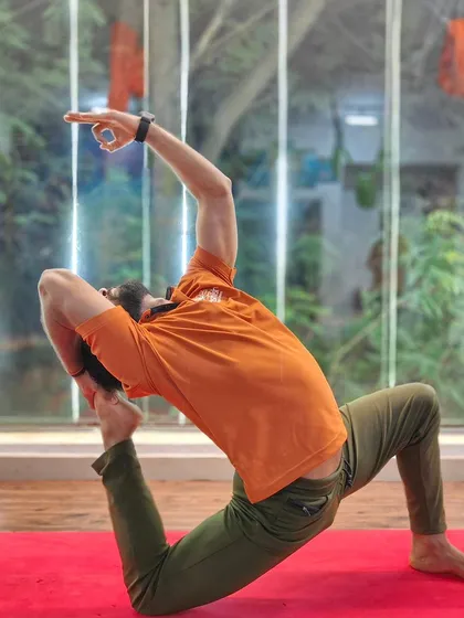 A powerful and deep lunge with a backbend, showing strength in the legs and openness in the chest.