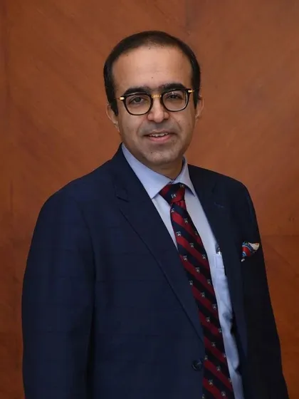 A professional portrait. My commitment is to provide you with the highest standard of dermatological care.