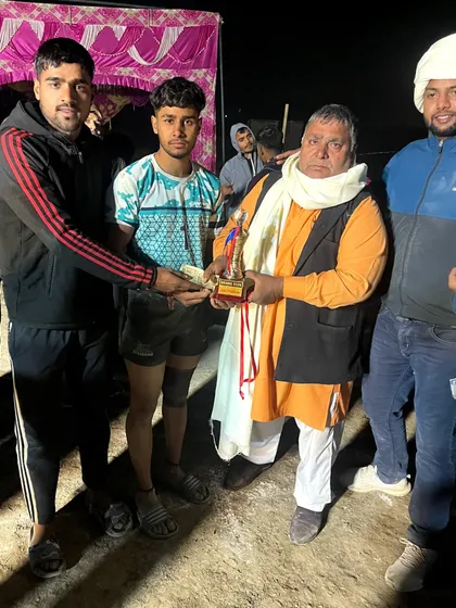 One of my players receiving a trophy for his performance at a Delhi tournament. We celebrate every achievement.
