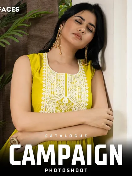 A model poses in a vibrant yellow ethnic dress with intricate white embroidery. The thoughtful expression and composition make this a beautiful shot for a catalogue or ad campaign.