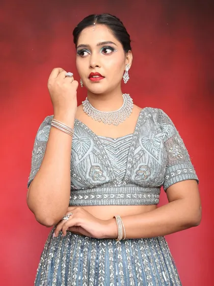 Another angle of this glamorous party look, showing the flawless base and bold lip colour.