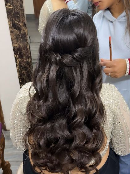 A simple half-up twist with soft waves. This is a timeless and elegant hairstyle that works for any event, from a party to a wedding.