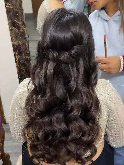 A simple half-up twist with soft waves. This is a timeless and elegant hairstyle that works for any event, from a party to a wedding.