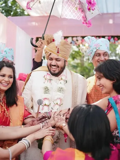 The groom's welcome by the bride's side of the family. This ritual is full of fun and playful teasing, and we capture all the excitement.